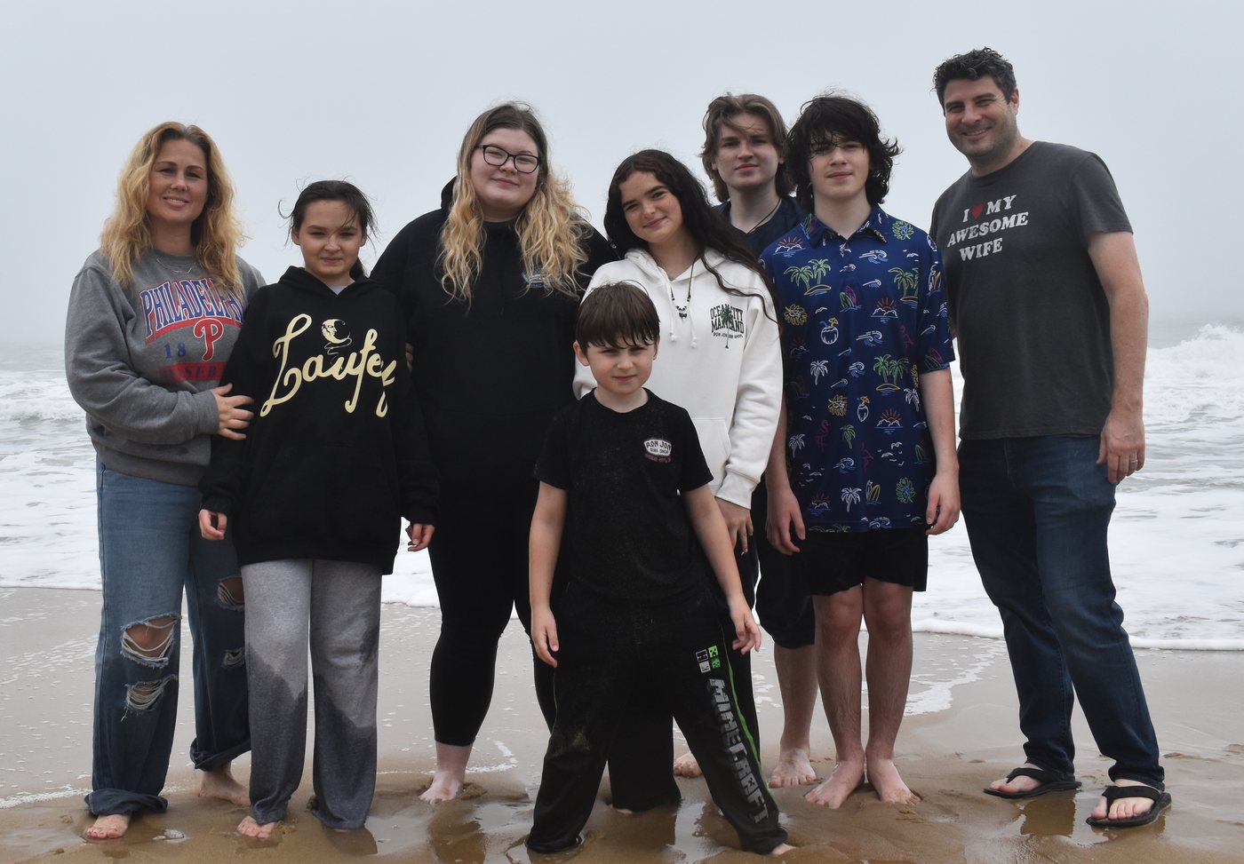 Bridget with her husband and six kids at the beach